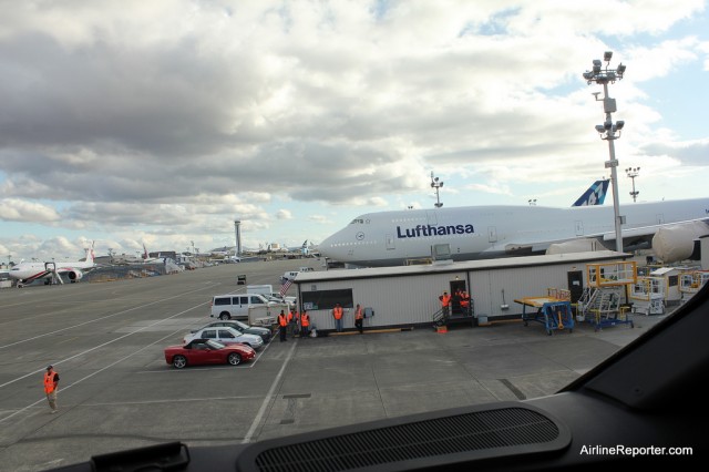 The Boeing flight line from the flight deck window of the 787 Dreamliner. Next door is Lufthansa's first Boeing 747-8 Intercontinental.