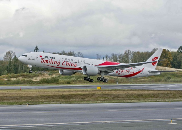 HI RES IMAGE (click for larger). Air China’s new 777-300ER adorned with the distinctive ’˜Smiling Faces’ livery takes-off from Paine Field Airport in Everett, Washington on October 30. Image from Boeing. 
