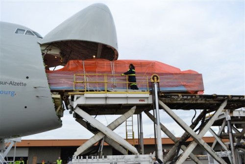 Easy does it. Surely don't want to damage a brand new plane. Photo from the Port of Seattle.