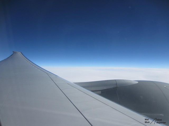 A raked Wingtip and a GE90 dominate the wing of the 777.