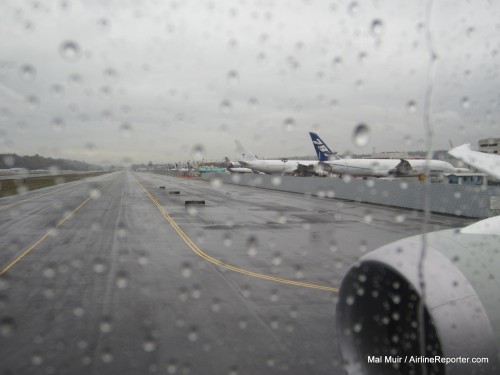 It was not surprising that it was raining in Seattle as Qatar's first 787 left Boeing Field. Photo by Mal Muir / AirlineReporter.com.