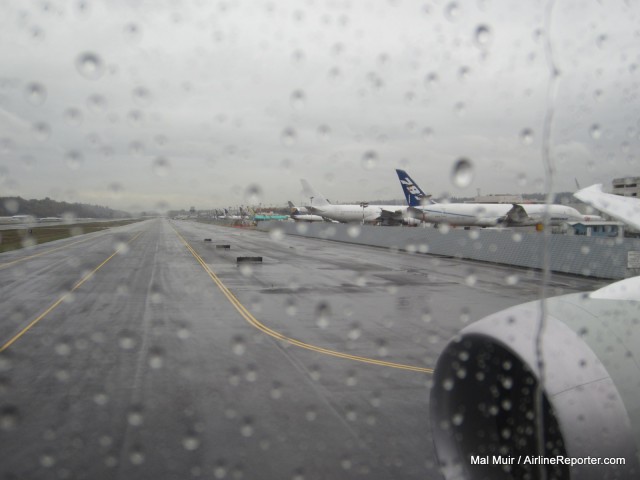 It was not surprising that it was raining in Seattle as Qatar's first 787 left Boeing Field. Photo by Mal Muir / AirlineReporter.com. 