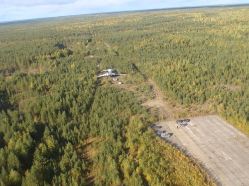 The TU-154M sits about 520 feet past the end of the runway at Izhma Airport.