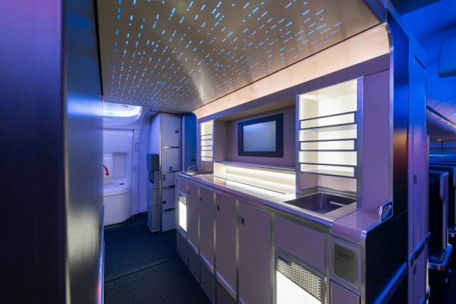 A walk-up bar in the premium cabin stocked with snacks and refreshments will be a first for any U.S. airline and adds another distinctive luxury feature to the 777-300ER. Photo from American Airlines. 