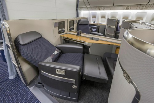 The cabin is configured with three classes, featuring lie-flat seats in First and Business Class. Photo from American Airlines.