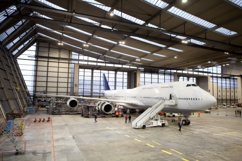 HI-RES IMAGE (click for larger). Lufthansa's Technik facility in Frankfurt is HUGE and has a way of making large aircraft look small. Photo by Lufthansa.