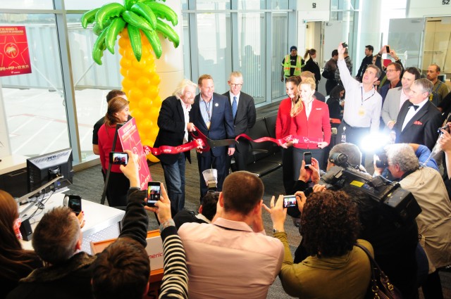 Celebrate Good Times! Sir Richard Branson helps to cut to ribbon at San Fransisco on December 15th. Photo by Nick Smith, AirlineReporter.com Correspondant. 