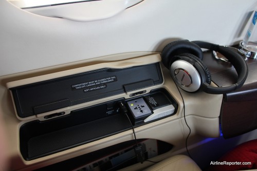 My seat had access to an outlet, Bose headphones to listen to XFM radio and a little storage area.