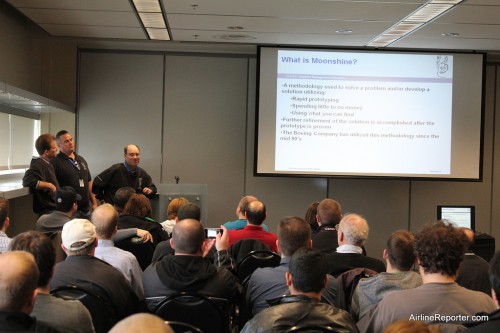 Members of the Boeing Moonshine team give a presentation to the aviation geek fest.