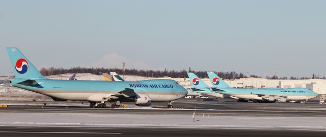 Two Korean Air Cargo Boeing 747-400F's welcome the new 747-8F. 