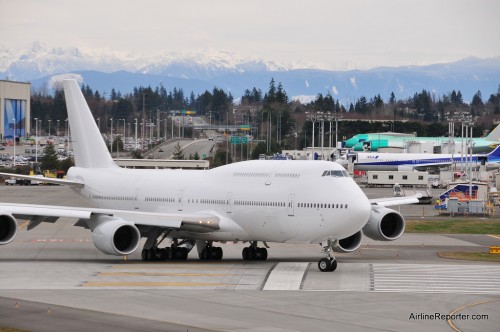 The first Boeing 747-8 Intercontinental to be delivered (A7-HHE) lines up on 16R at Paine Field.