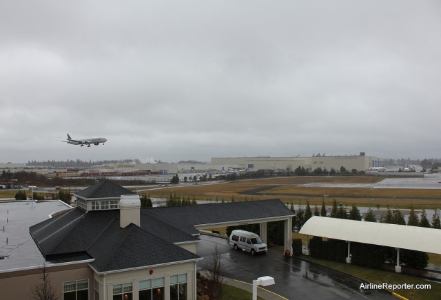 There is the rain and clouds I have grown to love. A Qatar Airways Boeing 777-300ER about to land at Paine Field - taken from my hotel room. 
