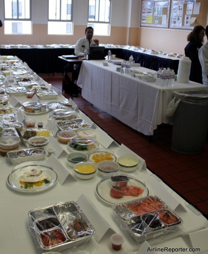 The room has food all around from first, business and economy levels of service.
