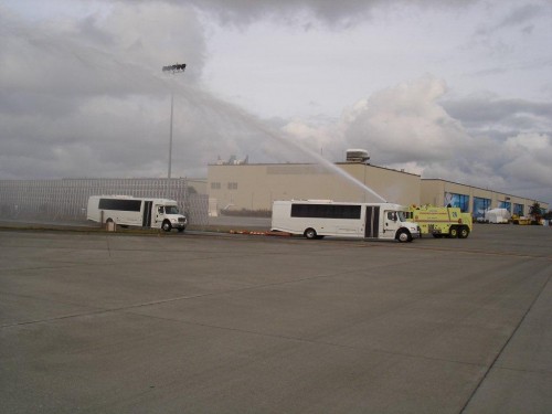 Three of the buses got a water canon salute. Photo by Snohomish County Airport Fire Dept.
