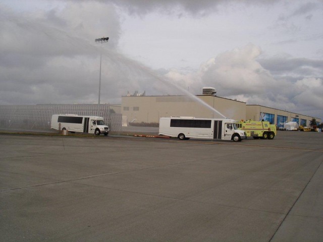 Three of the buses got a water canon salute. Photo by Snohomish County Airport Fire Dept. 