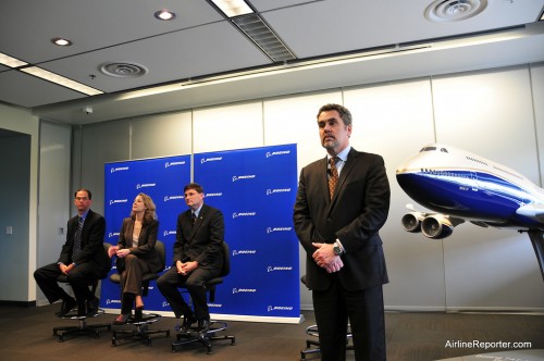 Taylor is the gentlemen closes to the model sitting. He had to leave this press conference for the first Boeing 747-8I delivery early -- he was flying the plane. Really.