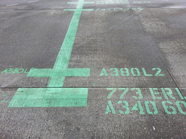 The ground is painted at gate S11 to prepare for an Airbus A380 at Seattle-Tacoma International Airport. 