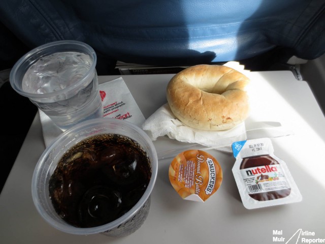 Staying hydrated and nourished on a flight means getting food however you can get it. A breakfast thanks to the Delta SkyClub