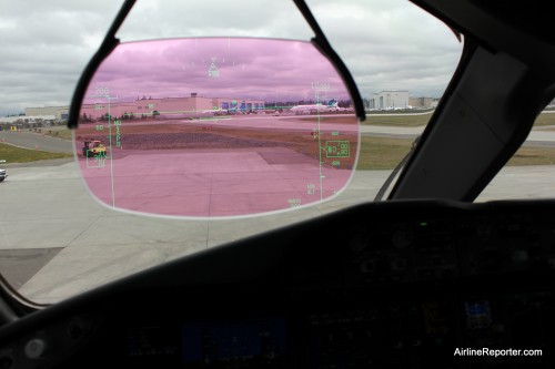 The Flight Deck has the best seats in the house. Shown here is the HUD (heads up display) with a JAL 787 in old livery and Dreamlifter in the background.