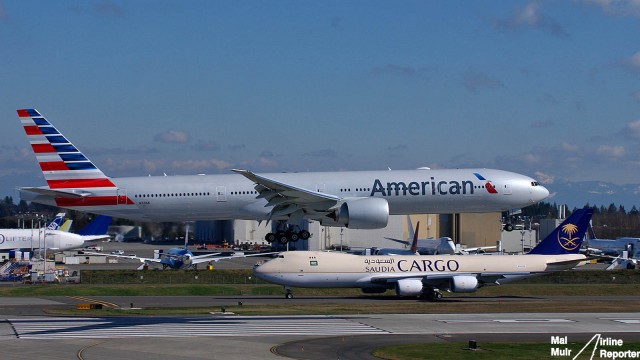 An American Airlines 777 in the New Livery Touches down as a Saudia Cargo 747-8F taxi's by  - Photo: Mal Muir | AirlineReporter.com