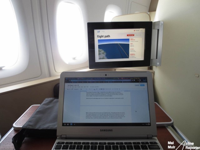 Getting some work done while I settle into the flight - Photo: Mal Muir | AirlineReporter.com