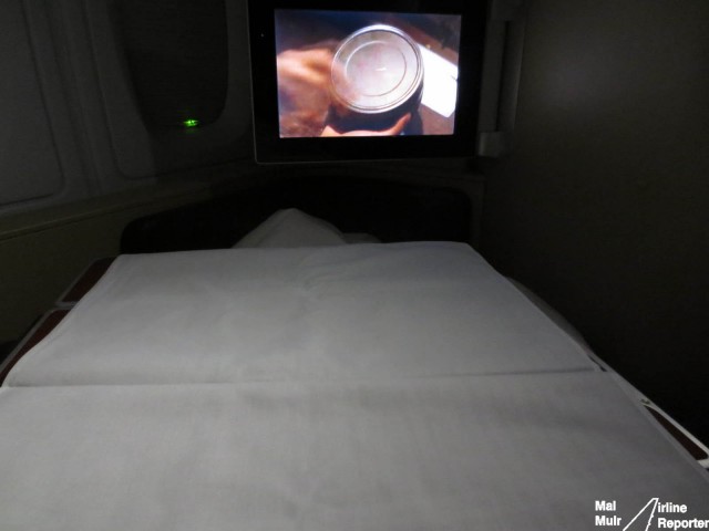 Isn't this how breakfast should be served? Under a doona, watching a movie, nice and relaxed - Photo: Mal Muir | AirlineReporter.com