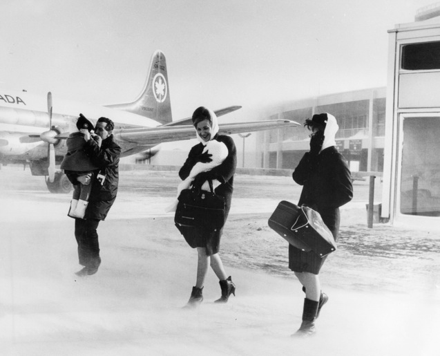A cold winter day, before Jetways. That's a Vickers Viscount in the background.