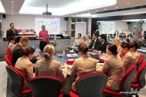 Every flight stewardess learns how to properly wear their uniform and wear make-up.