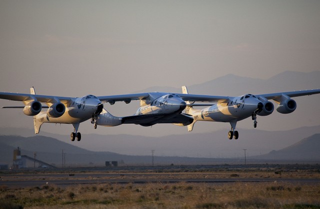 WhiteKnightTwo, christened VMS Eve after Richard Branson's mother Eve, and SpaceShipTwo, known as VSS Enterprise, take to the skies during a test flight in Mojave, CA, USA. Photo: Mark Greenberg