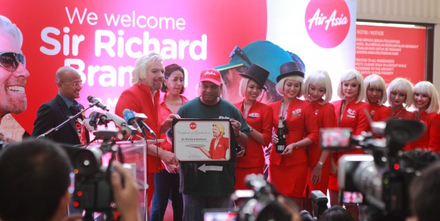 Tony Fernandes & The Air Asia Crew present Sir Richard Branson with his Training Graduation Certificate at the Completion of the Journey - Photo: Adam Lee, Air Asia