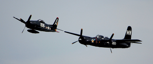 Not all the planes just sit on the ground. F7F Tigercat and F8F Bearcat in formation. Photo by Liz Matzelle. 