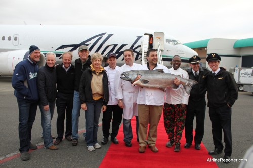 That is one big fish. Judges, pilots and chefs show off the 55 pound salmon.