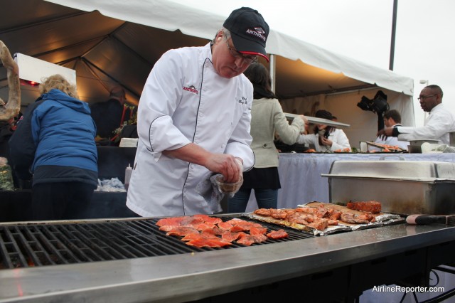 Cooking salmon in the outdoors early in the morning at an airport -- what more does one need?