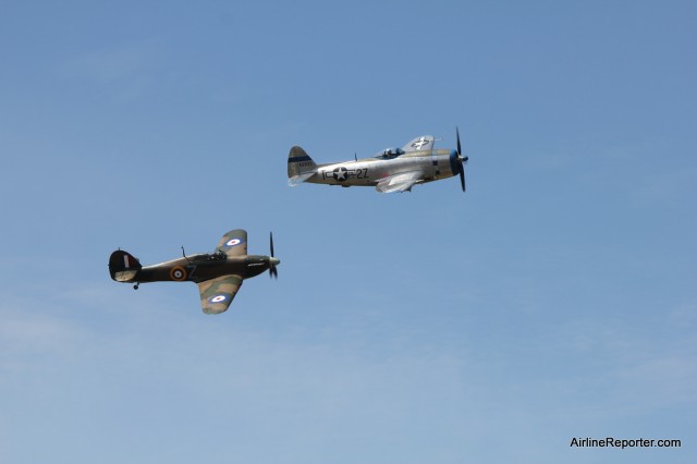 Hawker Hurricane Mk.XIIA and Republic P-47D Thunderbolt flying over Paine Field. 