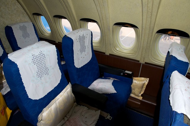 A first class seat in the Air Koryo IL-62 heading to North Korea. Photo by Bernie Leighton.