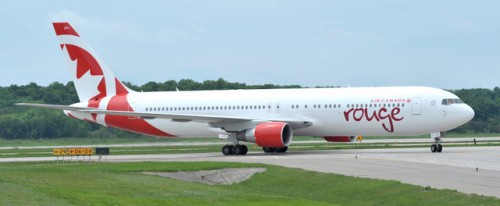 Air Canada rouge"s first newly painted Boeing 767 - 300 ER aircraft arrives at Mirabel airport