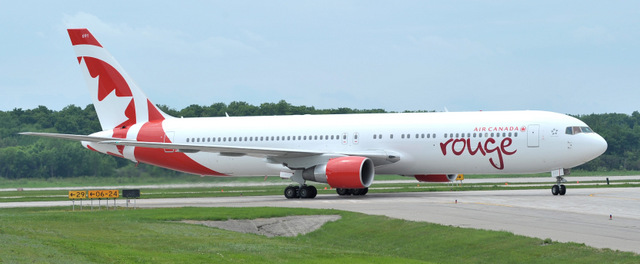 Air Canada rouge’s first newly painted Boeing 767 - 300 ER aircraft arrives at Mirabel airport