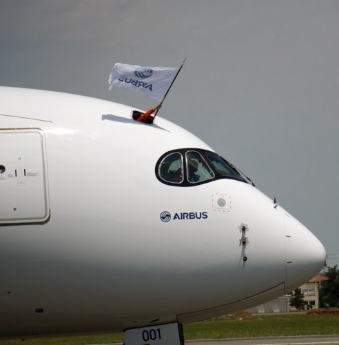 Airbus flag waving from the flight deck of the A350. Photo by Chris Sloan.