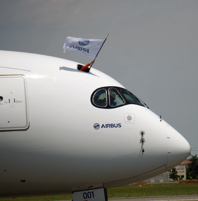 Airbus flag waving from the flight deck of the A350. Photo by Chris Sloan. 