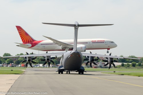 The Air India Boeing 787 Dreamliner lands while the Airbus A400 takes its position. Image by Jason Rabinowitz / Airchive.com.