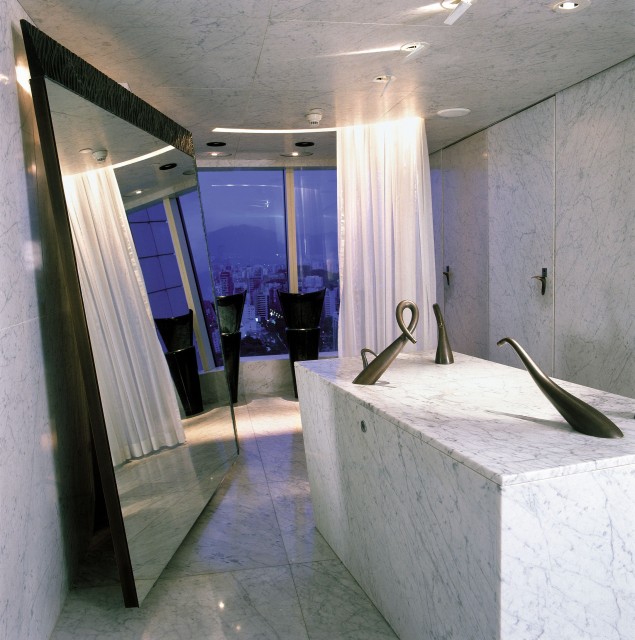 The Mens Room at Felix is definately unique.  The black basins at the back by the windows, those are the mens urinals and the white podium at the back... those are the sinks! - Photo: Peninsula Hotel Hong Kong