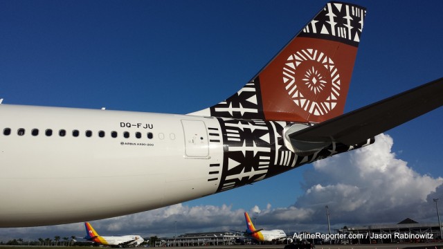 New and old. The Fiji Airways Airbus A330 tail with the older Air Pacific Boeing 747-400s in the background. 