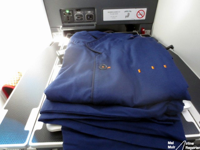 Why wear that suit & tie the whole flight?  Change into a pair of the ANA pyjamas and you will sleep so much better on your long haul flight - Photo: Mal Muir | AirlineReporter.com