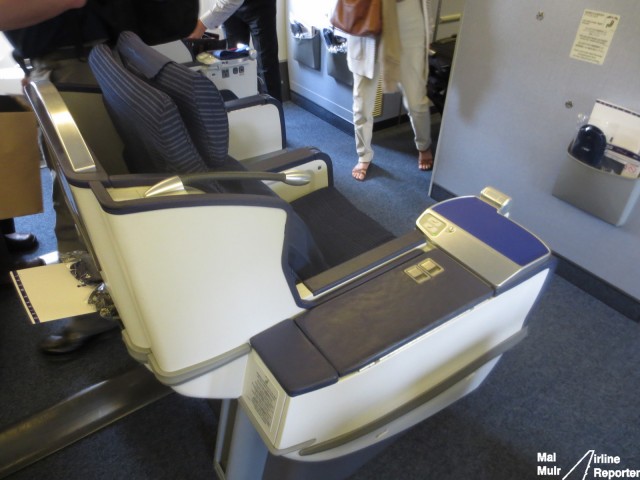 The ANA Business Cradle "Throne" seat.  A nice big storage compartment on the right side of the seat means you can store so much stuff - Photo: Mal Muir | AirlineReporter.com