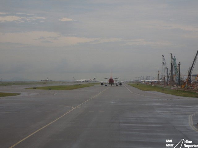 Waiting for our turn to Depart Hong Kong.  A lot of aircraft ahead of us this morning - Photo: Mal Muir | AirlineReporter.com