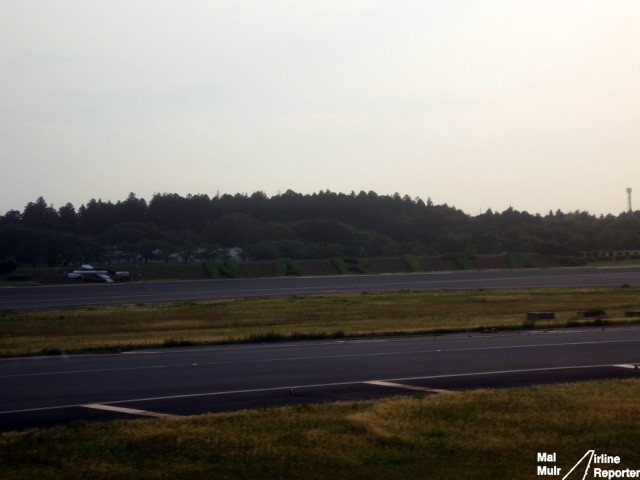 It is not hard to tell just where you are, and if the sign doesn't help, perhaps all the ANA & JAL aircraft around are a clue - Photo: Mal Muir | AirlineReporter.com