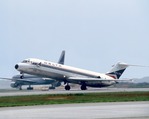 Delta DC-9 in updated livery. Check out the L1011 in the background. Image courtsey of Delta Air Lines.