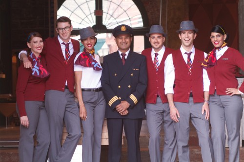 rouge flight attendants show off their new fashions. How about those fedoras?!