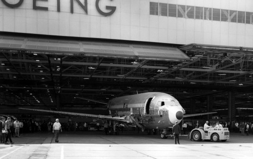 The prototype Boeing 737 rolls out of the original factory adjacent to Boeing Field. The factory wasn"t tall enough so the tail had to be attached after each one rolled out. At the time, Renton was at capacity with the 707 and 727 production. After 271 aircraft, production was moved to Renton in late 1970. This coincided with an aircraft production slow-down due to the recession of the early 1970s. Image courtesy: Boeing