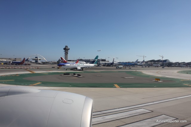 WIth the outer seat angled a bit towards the window, it makes looking outside a breeze. Taking off from LAX (and yes, I had permission to take this photo below 10,000 feet).  